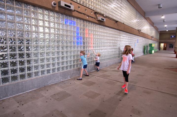 photo of children with LED installation created by UK College of Design