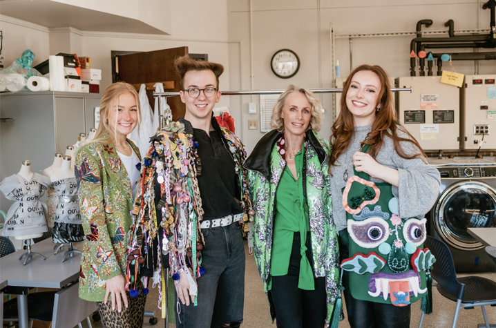 Elisabeth Goth, center right, with merchandising, apparel and textiles students Camille Downing, Briar Honeycutt and Emily Sheet wearing pieces from Goth’s collection. Photo by Sarah Caton.