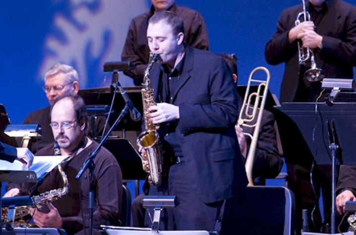 photo of BAJA sax player soloing at holiday concert