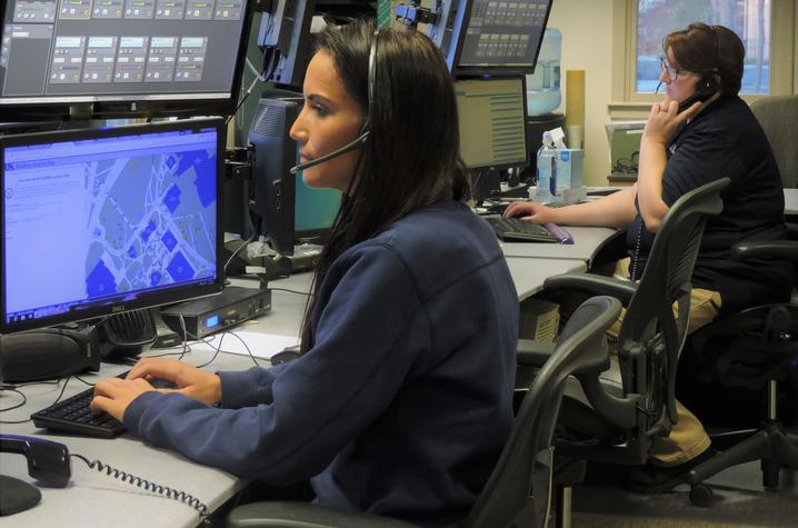 photo of UK dispatchers Heather Terrell, left, and Kortnie Osbourne, right, at their workstations at UKPD.