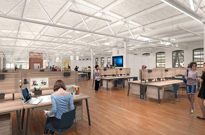 rendering of College of Design space after major renovation of the Reynolds Building -- showing tables and workspaces in large open area.