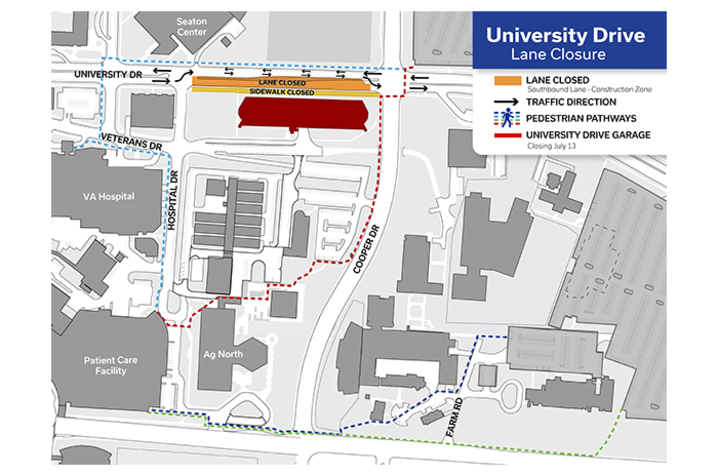 Map graphic showing a University Drive lane closure near campus buildings, with detour routes and color-coded lines indicating closed lanes, traffic control points and pedestrian access paths.