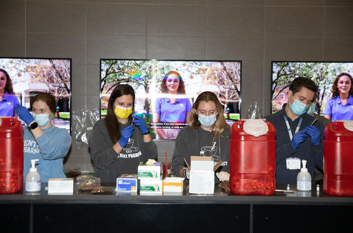 Pharmacy students and staff prepare the Covid Vaccine at Kroger Field on Jan. 22, 2021. Photo by Mark Cornelison | UK Photo.