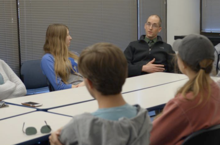 Nathan Vanderford talking with ACTION students