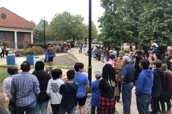 Earth Science Week Open House attendees gather for a volcano demonstration by UK Department of Earth and Environmental Sciences’ Pete Idstein. 