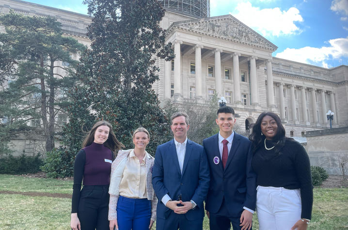 #iCANendthetrend Youth Advisory Board members and Governor Andy Beshear standing in front of the state capitol building in Frankfort