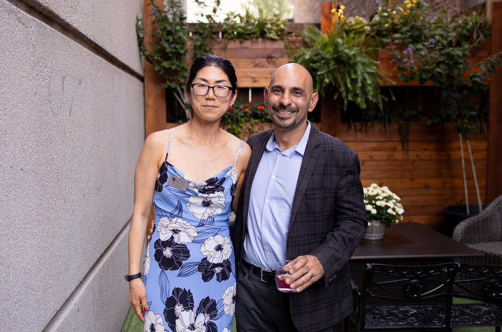UK's Yuha Jung (left) with Drexel University's Neville Vakharia (right), her coeditor, at the summer book launch party in Lexington. Photo by Mary Rollins Mathews, Rollins Studio.