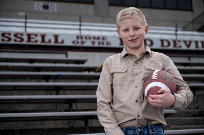 Image of William Dean holding a football