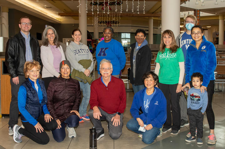 image of group of people posing for a photo inside a mall.