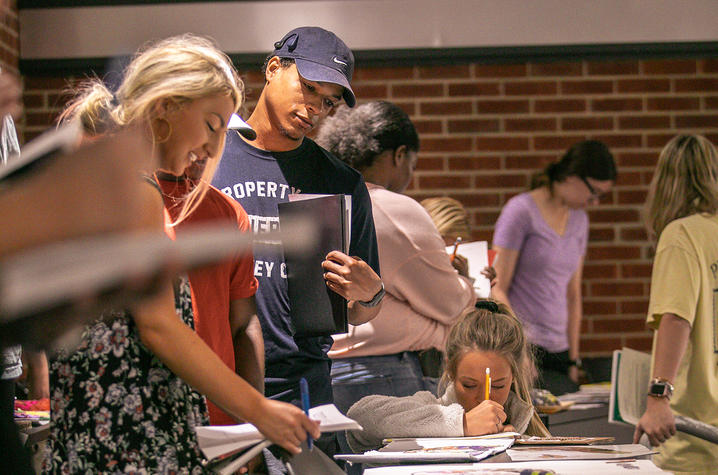 photo of students at art showcase