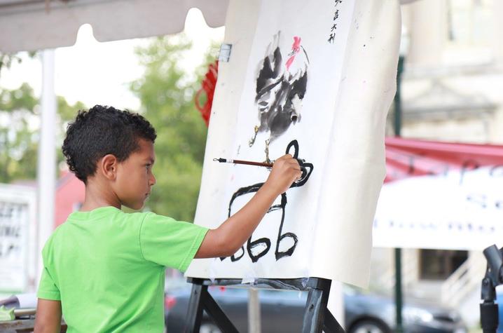 photo of child painting at Global Confucius Institute Day