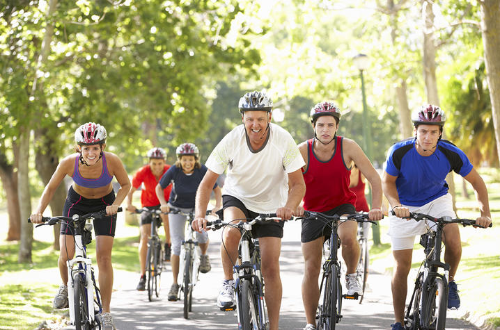 A group of people riding bikes.