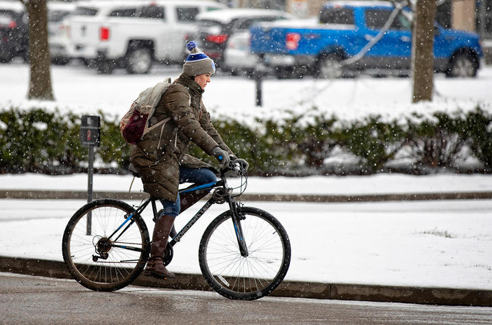 Women riding a bike.