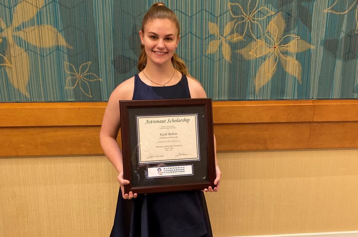 photo of Kayli Bolton holding ASF plaque