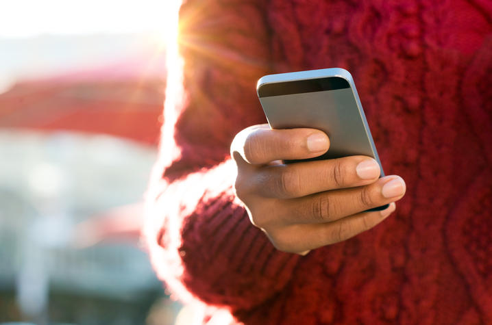 photo of cell phone in person's hand