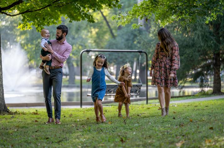 Image of Damron family walking through a park