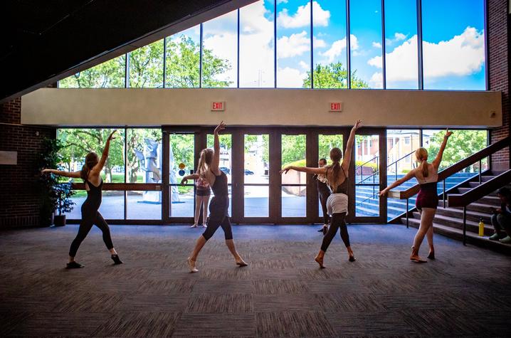 photo of 4 dancers at GSA in Singletary lobby