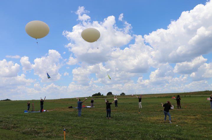 Photo of students launching balloons 