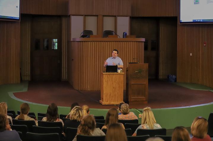 photo of man speaking to group