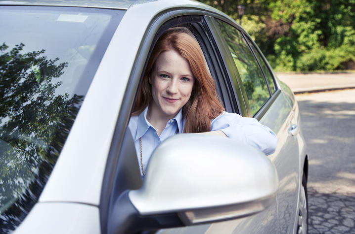 Woman in a car.