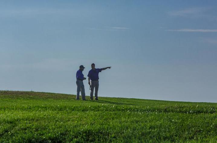 Two farmers on field