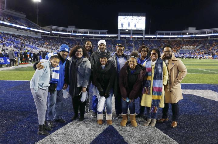 group of Office for Institutional Diversity staff members on Kroger Field at UK football game.