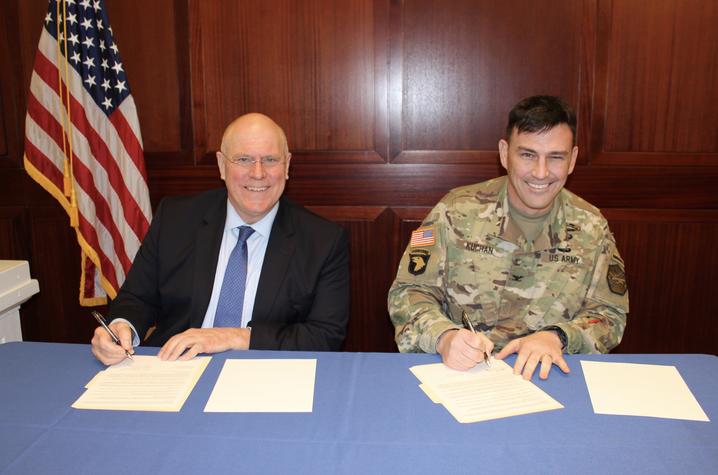 photo of David Blackwell and Col. Joseph Kuchan signing MOU