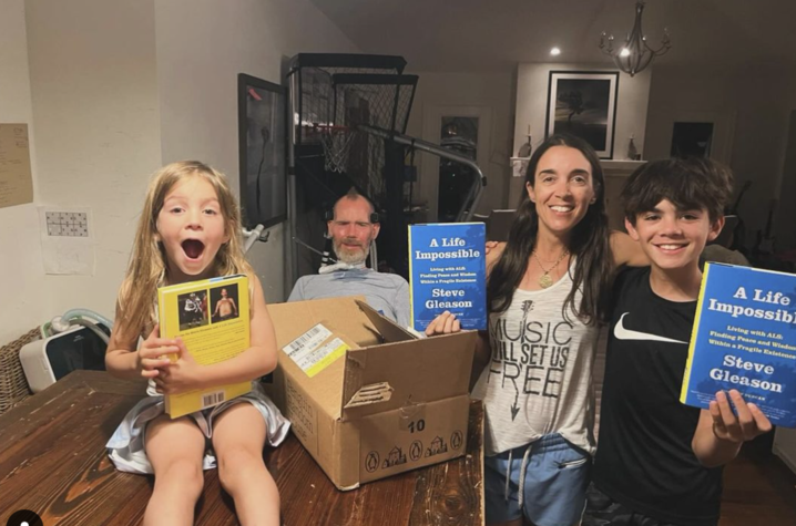 Steve Gleason and his family unboxing copies of his book “A Life Impossible.” Photo provided.