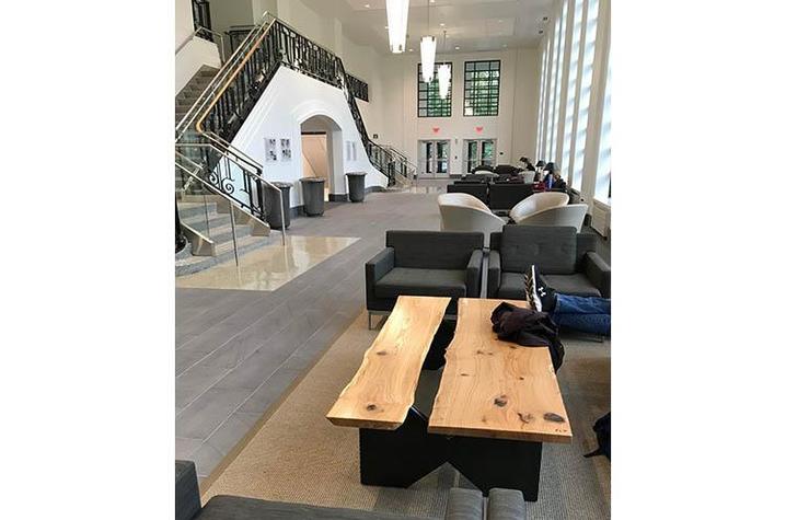 A coffee table in the Gatton Student Center great hall with other furniture in background