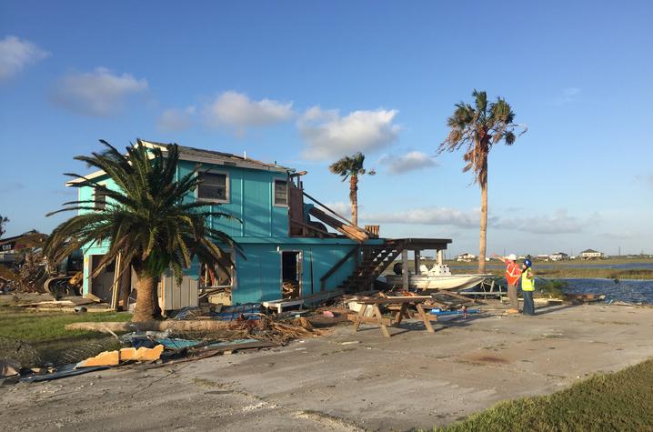 Photo of Mariantonieta Gutierrez Soto surveying damage