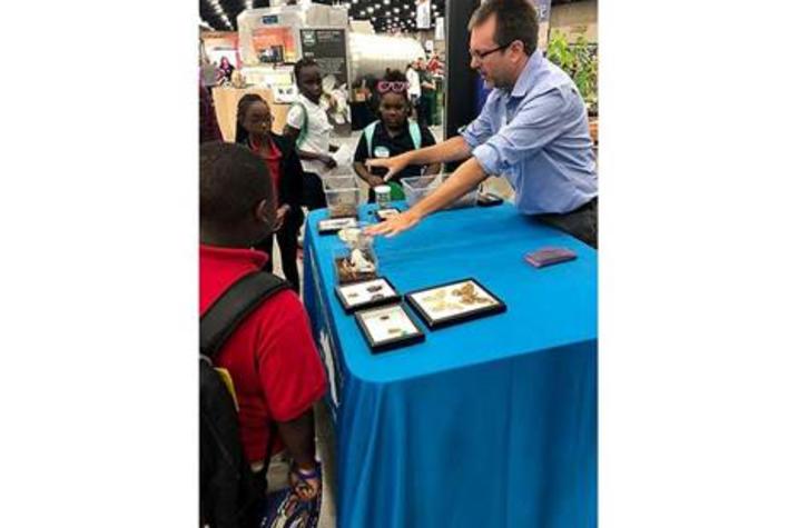 Blake Newton, UK entomology 4-H/youth extension specialist, shows fairgoers some of UK entomology's insect zoo during the 2018 Kentucky State Fair.