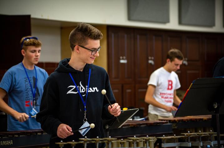 3 GSA students play perccussion instruments