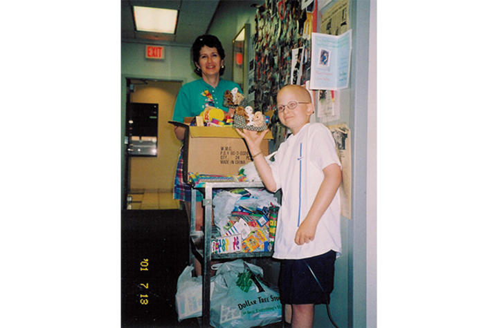 Jarrett with his mother by the Joy Cart