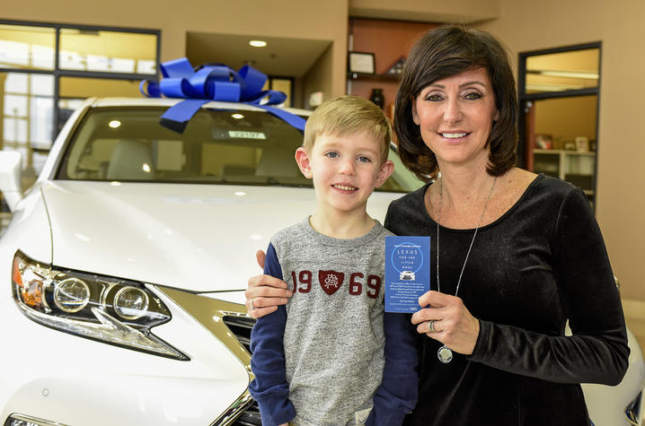 Brady Creemens with Lexus winner Eileen Potter. 