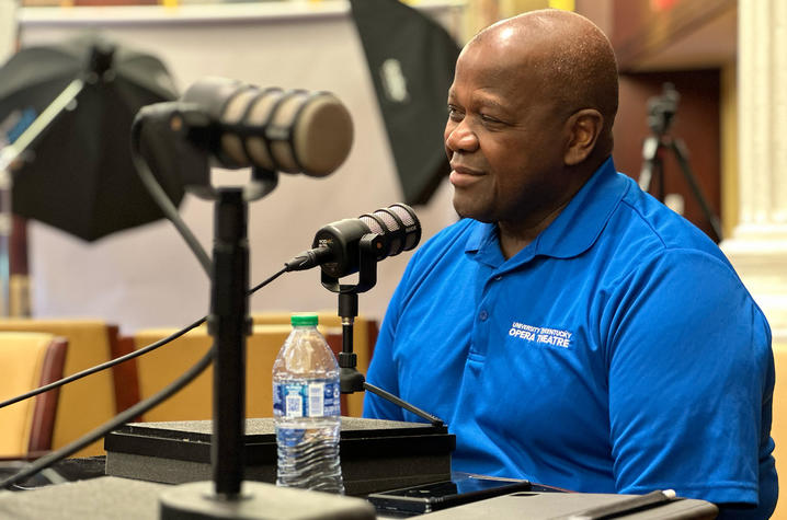 Everett McCorvey sitting in a podcast recording studio