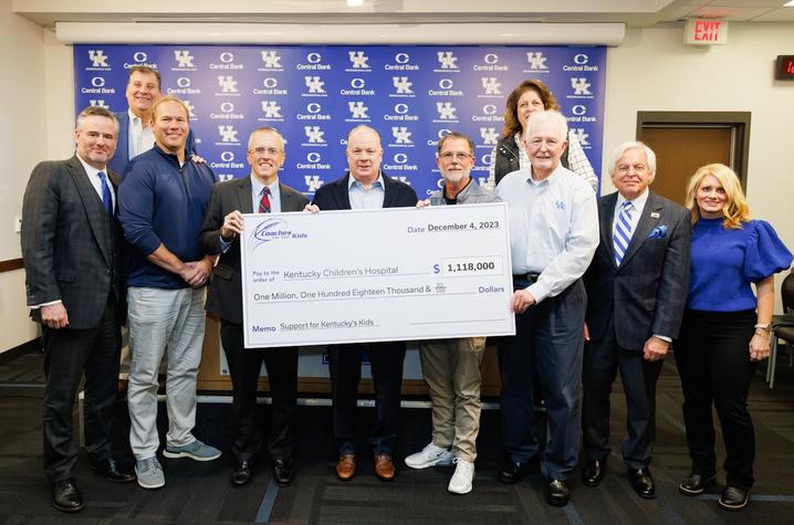 image of group of people with a check made out to KCH for over $1 million