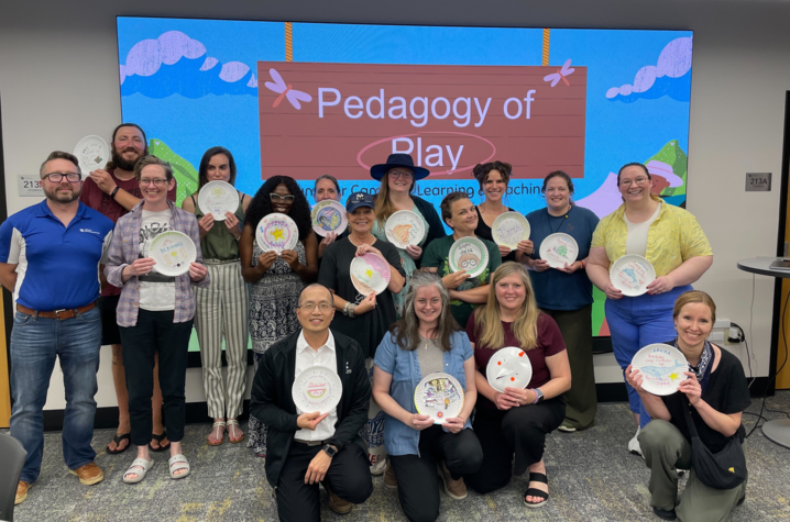 The "Pedagogy of Play" held by CELT was designed to help participants understand learning through ludic pedagogy. A group of instructors and graduate students holding their creations at the CELT "Pedagogy of Play" event.