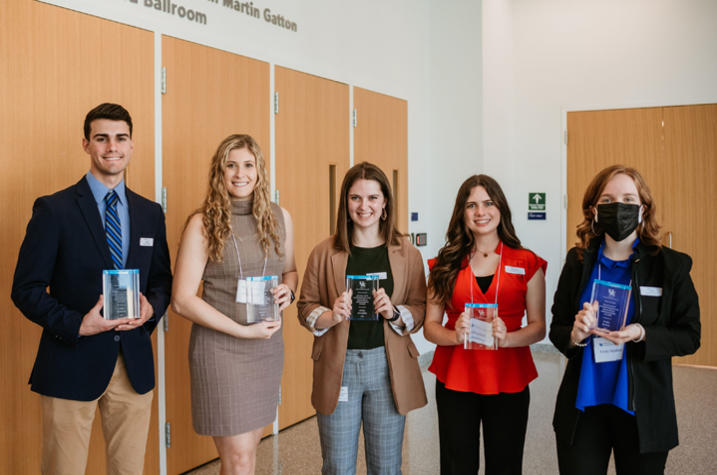 2022 Excellent Undergraduate Research Ambassadors Caleb Kennedy, Bridget Bolt, Shelby McCubbin, Gretchen Ruschman and Emily Keaton (not pictured is Courtney Martin).