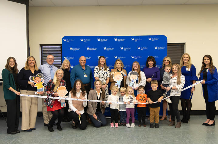 Image of group of people cutting a ribbon