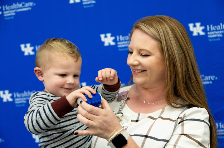 Image of woman holding a toddler.