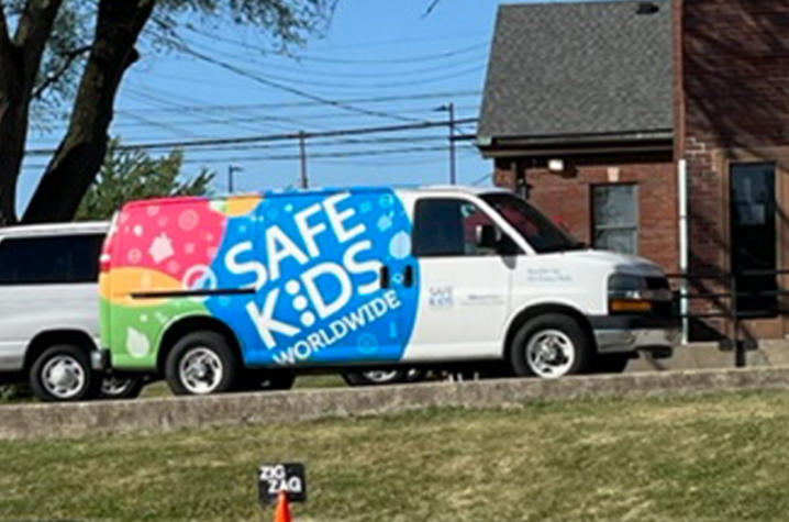image of safe kids van parked next to bike training course