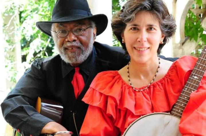 photo of Sparky and Rhonda Rucker seated holding guitar and banjo