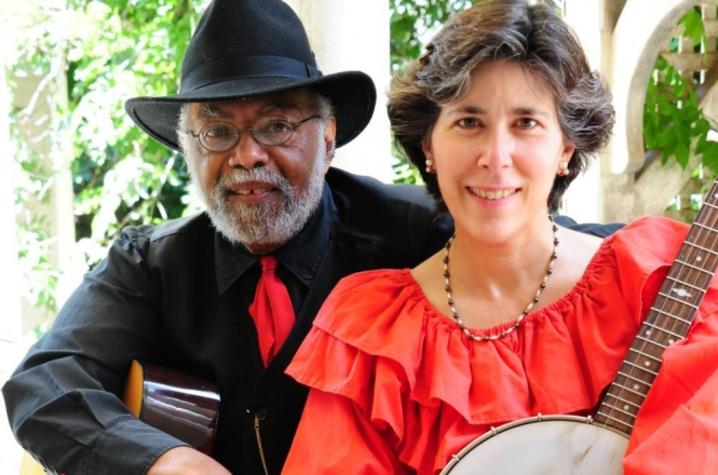 photo of Sparky and Rhonda Rucker holding instruments seated