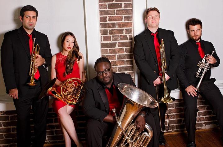 photo Alias Brass dressed in red and black holding instruments