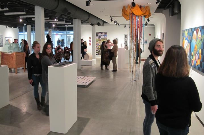 photo of visitors at Carey Ellis Juried Show at Open Studio