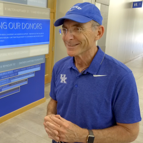 UK President Eli Capilouto in front of donor wall inside Jacobs Science Building