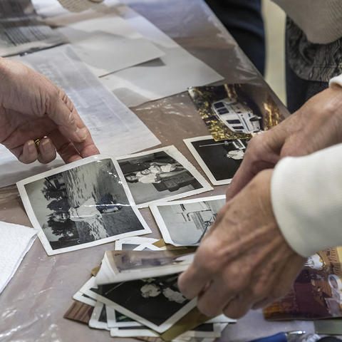Hands caring for photos 