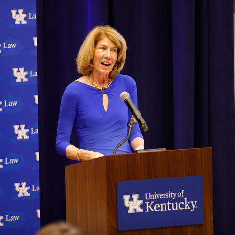 Dr. Martha Heyburn standing at podium at 2017 event