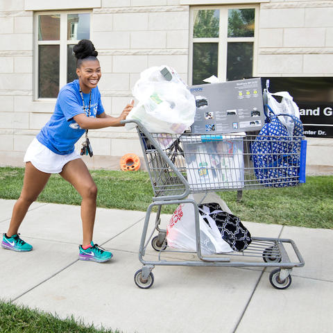 photo of student moving in to campus housing 