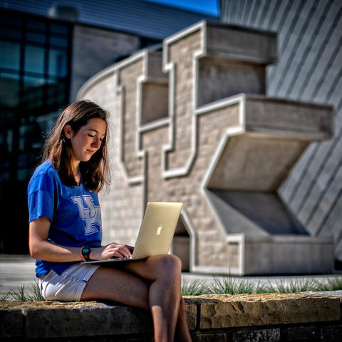 Photo of student in front of student center 